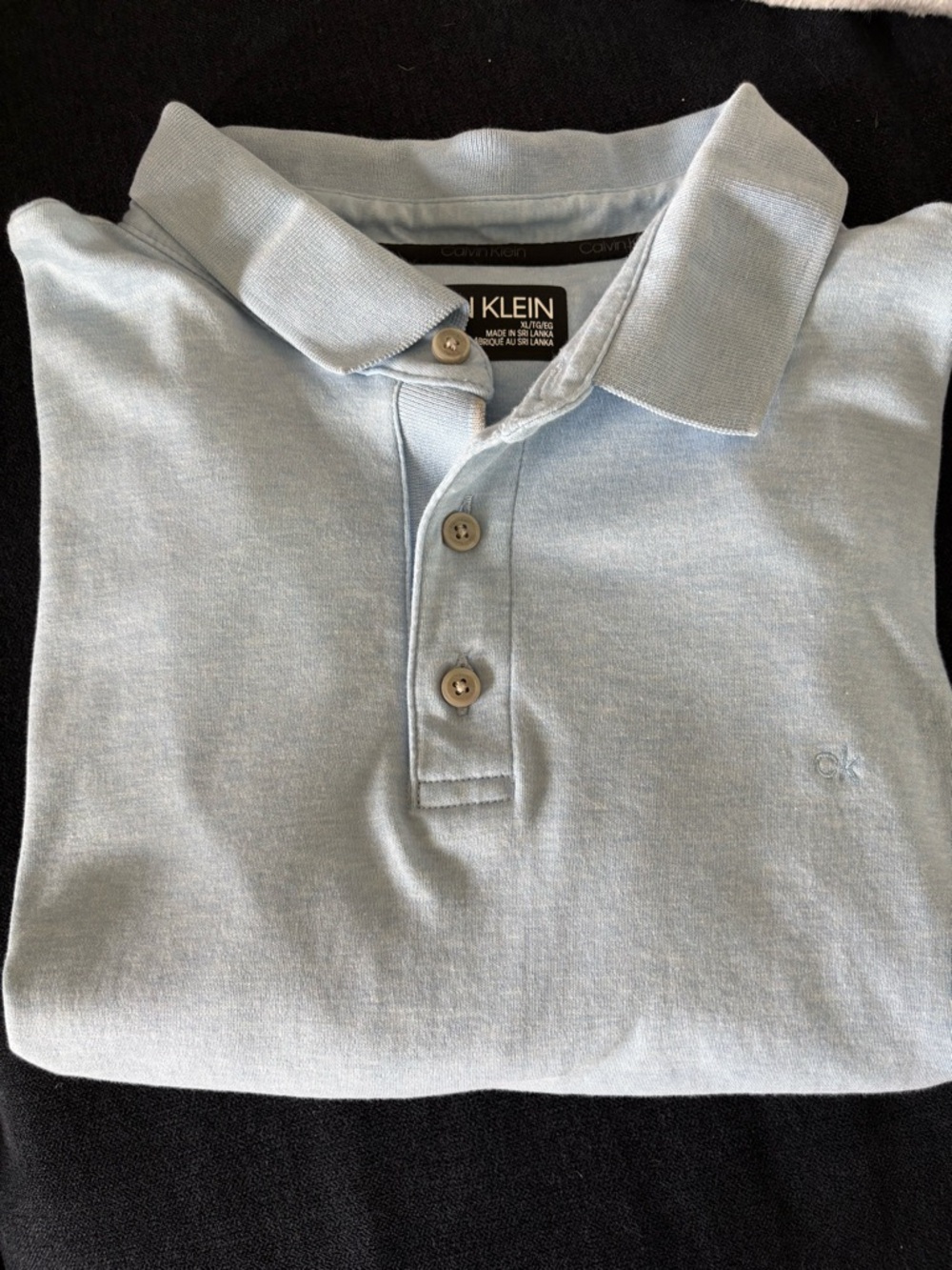 Calvin Klein Men's Pale Blue Polo Shirt with Subtle Logo